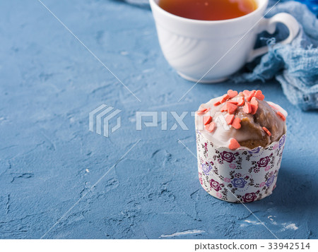 Cup of tea on blue background with flowers Cup of tea on blue background with flowers 33942514