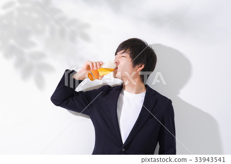Man drinking beer Copy space 33943541