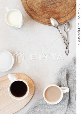 Cozy background with morning cups of coffee Cozy background with morning cups of coffee 33944789