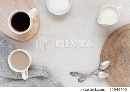 Cozy background with morning cups of coffee Cozy background with morning cups of coffee 33944790