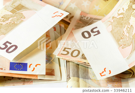 Fifty euro banknotes on white wooden background Fifty euro banknotes on white wooden background 33946211