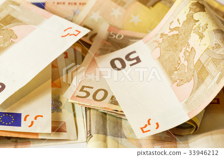 Fifty euro banknotes on white wooden background Fifty euro banknotes on white wooden background 33946212