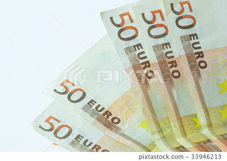 Fifty euro banknotes on white wooden background 33946213