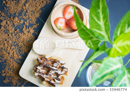 Waffles on the wood plate Waffles on the wood plate 33946774