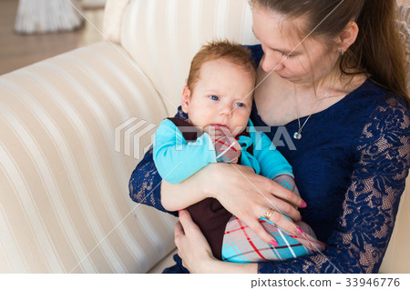bright portrait of adorable baby boy and his 33946776