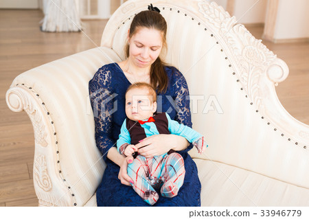 Adorable Caucasian baby with his mother. Portrait Adorable Caucasian baby with his mother. Portrait 33946779