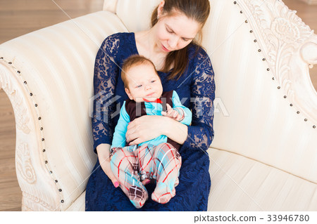 bright portrait of adorable baby boy and his 33946780