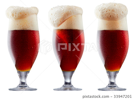 Mug of frosty dark red beer with foam Mug of frosty dark red beer with foam 33947201