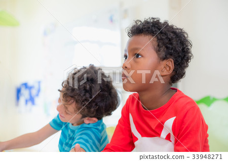 African American ethnicity kid with moody emotion African American ethnicity kid with moody emotion 33948271