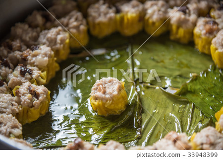 Chinese steamed dumplings (Dim Sum) with sauce 33948399