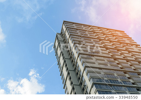 Glass building with blue sky Glass building with blue sky 33948550