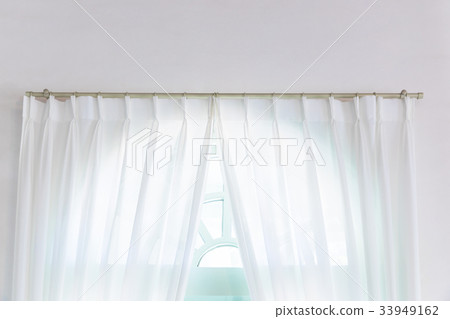 White curtain on the windowsill White curtain on the windowsill 33949162