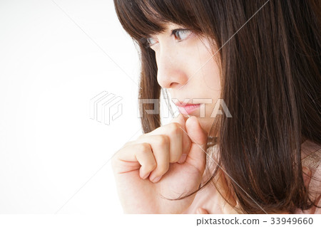 Young woman coughing with a cold Young woman coughing with a cold 33949660