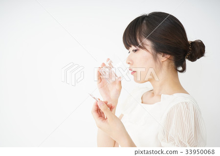 Young woman taking oral medicine Young woman taking oral medicine 33950068
