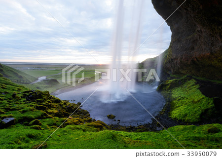 Sunrise on Seljalandfoss waterfall Sunrise on Seljalandfoss waterfall 33950079