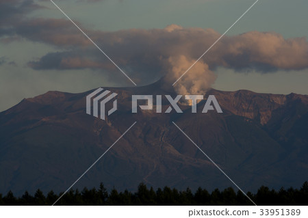 Crater at the top of the mountain raising the plume Crater at the top of the mountain raising the plume 33951389