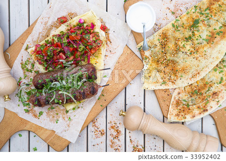 meat kebab of minced beef or lamb with vegetables. 33952402