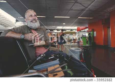 Beaming grandfather writing in notebook Beaming grandfather writing in notebook 33952882