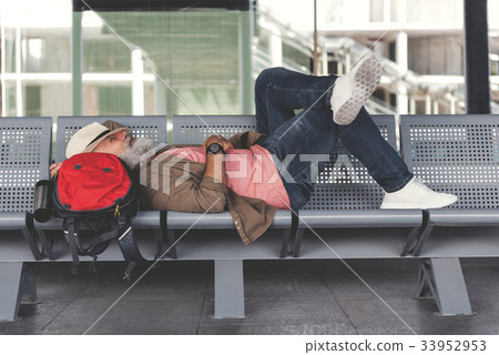 Tired man waiting for flight Tired man waiting for flight 33952953
