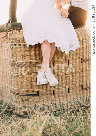 The close-up photo of the bride`s legs sitting on 33953184
