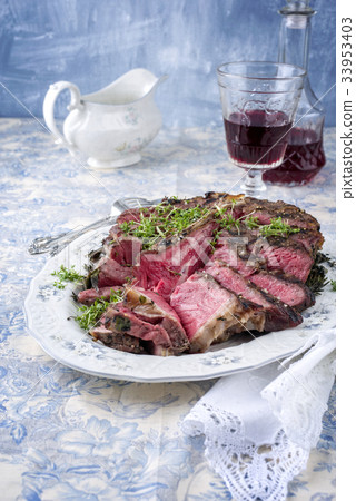 Sliced Porterhouse Steak on Plate 33953403