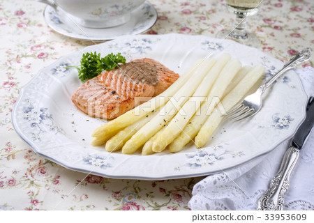 White Asparagus with Salmon Filet on Plate 33953609