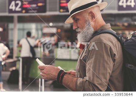 Serious bearded retire watching at cheque 33953644