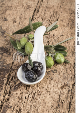 olives on wooden table olives on wooden table 33954724