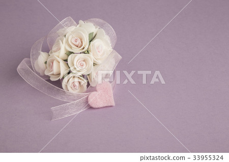 rose and ribbon on purple background 33955324