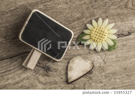 wooden heart and an empty chalkboard wooden heart and an empty chalkboard 33955327