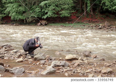 photographer takes pictures of rough river photographer takes pictures of rough river 33956749