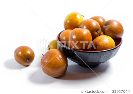 Jujube fruits close up on white background. Jujube fruits close up on white background. 33957044