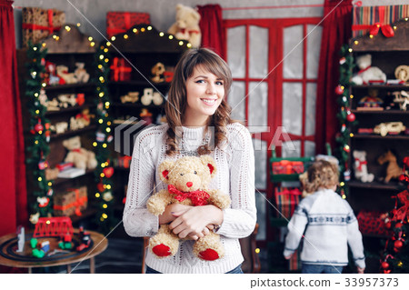 Portrait of pretty girl on background Christmas 33957373