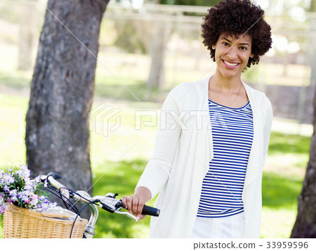 Happy young woman with bicycle Happy young woman with bicycle 33959596