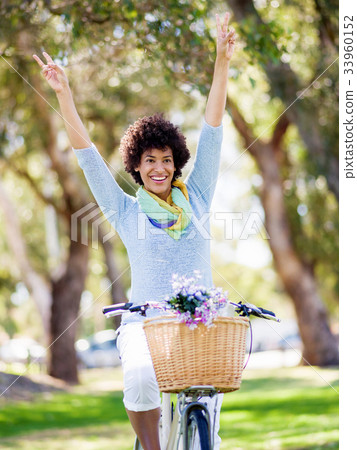 Happy young woman with bicycle Happy young woman with bicycle 33960152