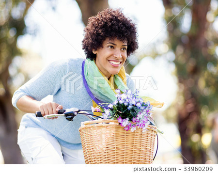 Happy young woman with bicycle 33960209