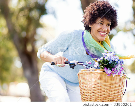 Happy young woman with bicycle Happy young woman with bicycle 33960261