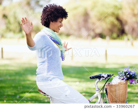 Happy young woman with bicycle Happy young woman with bicycle 33960267