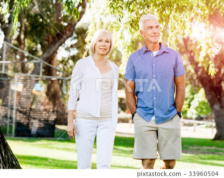 Senior couple relaxing in park 33960504
