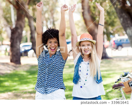 Two women friends in park Two women friends in park 33961641