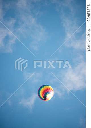 Hot-air balloons cloudy blue sky 33961898