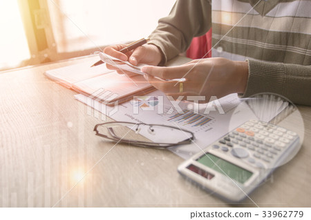 Business man pointing on data paper 33962779