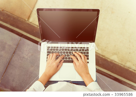 Woman hands typing on keyboard computer laptop 33965586