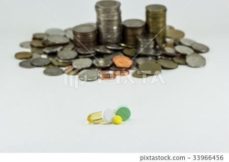 Medicine and money on white background. Medicine and money on white background. 33966456