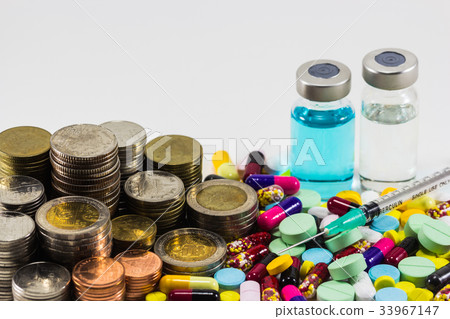 Medicine with money and syringe on Medicine with money and syringe on 33967147