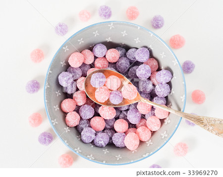 Purple and pink candies in bowl Purple and pink candies in bowl 33969270