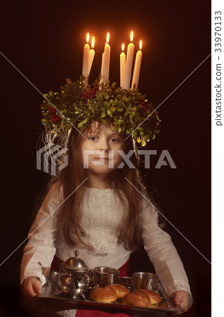 Little caucasian girl in Saint Lucia costume 33970133