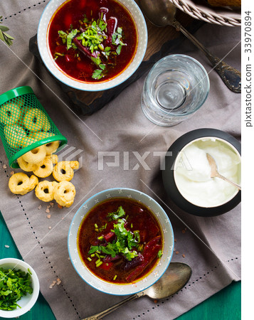 Beetroot soup served in bowls on napkin Beetroot soup served in bowls on napkin 33970894