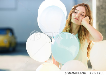 beautiful woman with flying multicolored balloons beautiful woman with flying multicolored balloons 33971313
