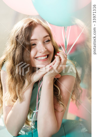 beautiful woman with flying multicolored balloons beautiful woman with flying multicolored balloons 33971316
